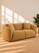 Load image into Gallery viewer, Image 2 of 5: Savino upholstered loveseat in Warm Ochre fabric with rounded shelter arms, channel back detailing, and plush two-seat cushions
