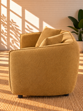 Load image into Gallery viewer, Image 4 of 5: Savino upholstered loveseat in Warm Ochre fabric with rounded shelter arms, channel back detailing, and plush two-seat cushions
