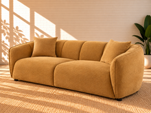 Load image into Gallery viewer, Image 3 of 5: Savino upholstered sofa in Warm Ochre fabric with rounded shelter arms, channel back detailing, and broad cushioned seats
