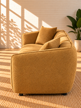 Load image into Gallery viewer, Image 4 of 5: Savino upholstered sofa in Warm Ochre fabric with rounded shelter arms, channel back detailing, and broad cushioned seats
