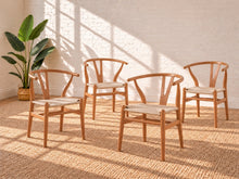 Load image into Gallery viewer, Sculptural blonde tone dining chair with curved wood back, central cutout splat and natural woven cord seat.
