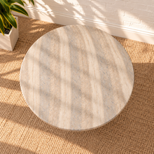 Load image into Gallery viewer, Selah round dining table with warm faux travertine finish, softly patterned top, and sculptural rounded pedestal base.
