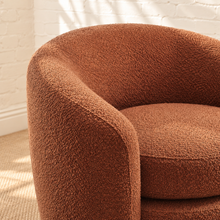 Load image into Gallery viewer, Sienna lounge chair in burnt sienna bouclé with curved barrel back, rounded arms, and removable seat cushion

