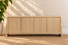 Load image into Gallery viewer, Sloan Minimalist Buffet Credenza in Blonde Oak with four doors, interior shelving, and tapered legs
