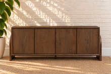 Load image into Gallery viewer, Sloan Minimalist Buffet Credenza in Warm Walnut with four doors, interior shelving, and tapered feet
