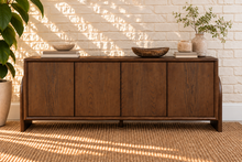 Load image into Gallery viewer, Sloan Minimalist Buffet Credenza in Warm Walnut with four doors, interior shelving, and tapered feet
