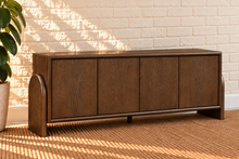 Load image into Gallery viewer, Sloan Minimalist Buffet Credenza in Warm Walnut with four doors, interior shelving, and tapered feet

