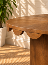 Load image into Gallery viewer, Solenn counter height table in Warm Walnut oak veneer with round tabletop, scalloped edge detail, and cylindrical pedestal.
