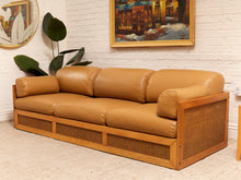 Load image into Gallery viewer, Early 1980’s Italian Sofa with Caning Detail and New Leather Upholstery
