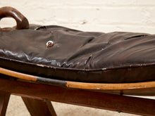 Load image into Gallery viewer, Vintage Leather Saddle Stool with Tufted Seat and Sculptural Wood Frame as found
