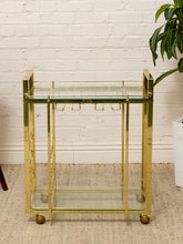 Load image into Gallery viewer, Vintage Hollywood Regency Brass Bar Cart with Glass Shelves
