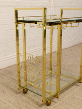Load image into Gallery viewer, Vintage Hollywood Regency Brass Bar Cart with Glass Shelves
