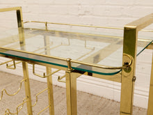 Load image into Gallery viewer, Vintage Hollywood Regency Brass Bar Cart with Glass Shelves
