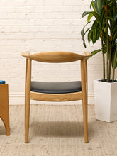 Load image into Gallery viewer, Modern Sculptural Oak Horseshoe Armchair with Black Seat
