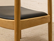 Load image into Gallery viewer, Modern Sculptural Oak Horseshoe Armchair with Black Seat
