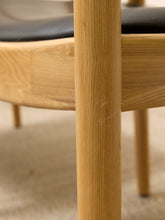 Load image into Gallery viewer, Modern Sculptural Oak Horseshoe Armchair with Black Seat
