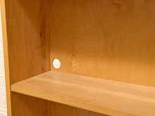 Load image into Gallery viewer, Close-up of a light natural wood shelf and backing board with a circular hole cut into the back panel.
