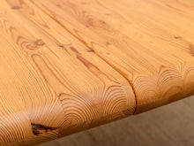Load image into Gallery viewer, Close-up of a light natural wood tabletop showing the grain pattern and a seam along the edge.
