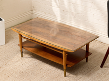 Load image into Gallery viewer, Vintage Lane Furniture Copenhagen coffee table with inset glass top, warm wood frame, tapered legs, and lower shelf.
