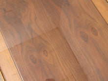 Load image into Gallery viewer, Close-up of a polished wood tabletop with visible grain and a glossy finish, showing reflections on the surface.
