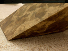 Load image into Gallery viewer, A wedge-shaped rug or mat with a mottled brown and beige stone-like pattern, shown resting on a textured beige carpet.
