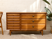 Load image into Gallery viewer, Vintage mid-century walnut dresser with six narrow drawers, three wide drawers, round pulls, sculptural wood knobs, and tapered legs.
