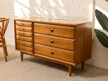 Load image into Gallery viewer, Vintage mid-century walnut dresser with six narrow drawers, three wide drawers, round pulls, sculptural wood knobs, and tapered legs.
