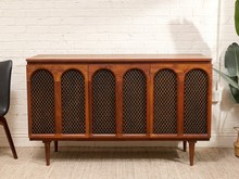 Load image into Gallery viewer, Vintage Barzilay walnut stereo console cabinet with six arched lattice grille panels, dark inserts, and slender tapered legs.
