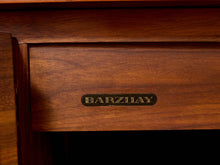 Load image into Gallery viewer, Close-up of a wooden drawer front with a small oval black badge reading BARZHIAY in gold lettering.
