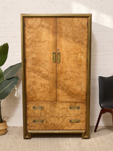 Load image into Gallery viewer, Vintage Mastercraft tall cabinet with dramatic burl wood veneer, brass-tone framing, double doors, and two lower drawers.
