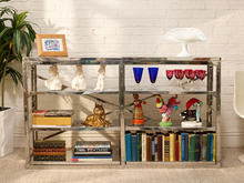 Load image into Gallery viewer, Chrome étagère console with multiple mirrored glass shelves, open rectangular frame, and decorative X-brace supports.
