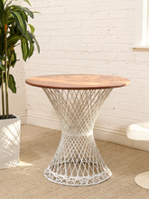 Load image into Gallery viewer, Vintage 1960s round wood dining table with sculptural white fiberglass hourglass pedestal base.
