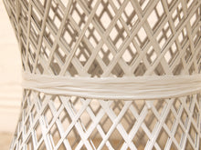 Load image into Gallery viewer, Close-up of a white woven rattan or wicker chair back, showing the diamond lattice pattern and a thick horizontal reinforcing band.
