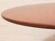 Load image into Gallery viewer, Close-up of a round wooden table top with a polished mahogany finish and a rounded beveled edge, set against a light beige background.
