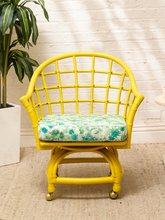 Load image into Gallery viewer, Image 6 of 20: Set of four vintage bright yellow rattan barrel chairs with floral cushions
