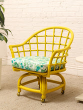 Load image into Gallery viewer, Image 7 of 20: Set of four vintage bright yellow rattan barrel chairs with floral cushions, alternate view 2
