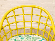 Load image into Gallery viewer, Image 12 of 20: Set of four vintage bright yellow rattan barrel chairs with floral cushions, alternate view 7
