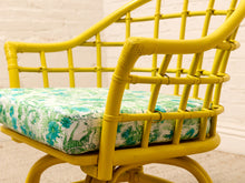 Load image into Gallery viewer, Image 15 of 20: Set of four vintage bright yellow rattan barrel chairs with floral cushions, alternate view 10
