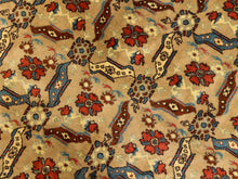 Load image into Gallery viewer, A close-up of a patterned rug or textile with a beige background and repeating floral motifs in red, blue, brown, and cream.
