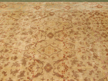 Load image into Gallery viewer, A traditional oriental-style area rug with an intricate floral and geometric pattern in beige, rust brown, and muted pink tones.
