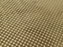 Load image into Gallery viewer, A close-up of a textured fabric with a repeating checkered pattern in beige and brown.
