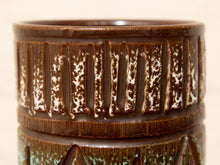 Load image into Gallery viewer, Close-up of a vase with a dark brown glazed finish, featuring vertical textured bands and a speckled pattern.

