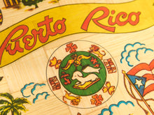 Load image into Gallery viewer, Close-up of a Puerto Rico themed wooden board game or map, featuring the yellow banner with red 'Puerto Rico' text, the Puerto Rican coat of arms, and colorful hand-painted details.
