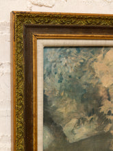 Load image into Gallery viewer, Close-up of an ornate vintage-style picture frame with a distressed gold and dark brown border, mounted on a white painted brick wall. A portion of a textured oil painting with blue, gray, and beige tones is visible inside the frame.
