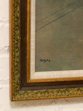 Load image into Gallery viewer, Close-up of an ornate vintage picture frame with gold and dark brown detailing, mounted on a white painted brick wall. The framed artwork shows a muted gray-green textured surface with a small dark signature near the bottom left.
