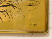 Load image into Gallery viewer, Close-up of a framed artwork with a textured gold background, black brushstroke botanical lines, and a gold frame mounted on a white brick wall.
