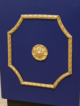 Load image into Gallery viewer, A close-up of a dark blue cabinet or drawer front featuring a decorative gold octagonal frame with a central gold floral medallion.
