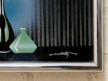 Load image into Gallery viewer, Close-up of a framed still life painting showing a green vase, dark bottle, vertical dark shapes, and a silver frame mounted on a light textured wall.
