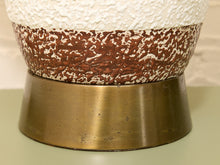 Load image into Gallery viewer, Close-up of a ceramic table lamp base featuring a textured white upper section, a brown and white speckled middle band, and a brushed brass-colored lower pedestal.
