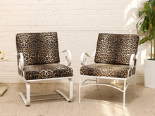 Load image into Gallery viewer, Vintage lounge chair with brown and black leopard print upholstery, white sculptural frame, and curled scroll arms
